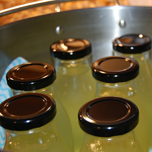 place bottles in pan waterbath